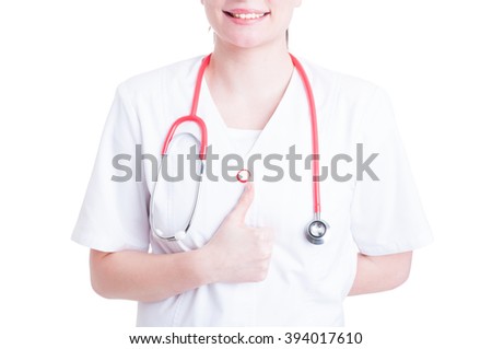 Happy smiling female doctor with thumbs up gesture isolated on white background as approval concept