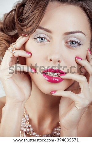 beauty young luxury woman with jewellery, rings, nails close up on white