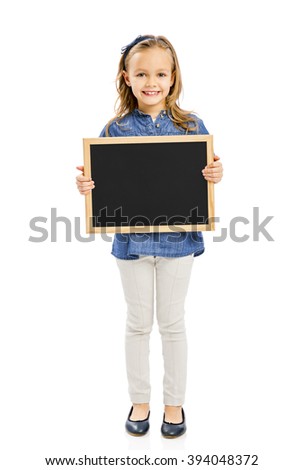 Cute little girl holding a chalkboard, isolated on white