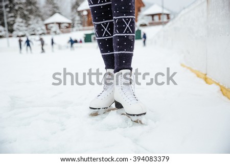 Closeup portrait of a female legs in ice skates