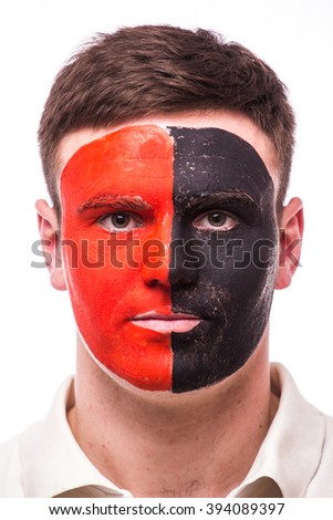 Portrait Albanian football fan in game support of  Albania national team on grey background. European 2016 football fans concept.