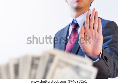 Businessman refuses to receive money - no bribery and corruption concept