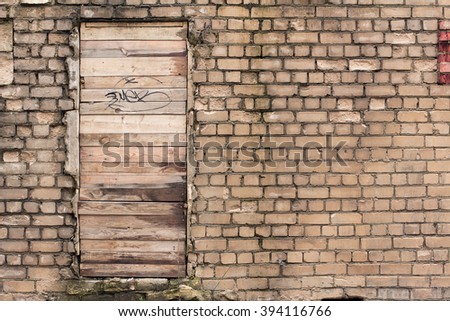 Old brick wall and door. Grunge texture. background