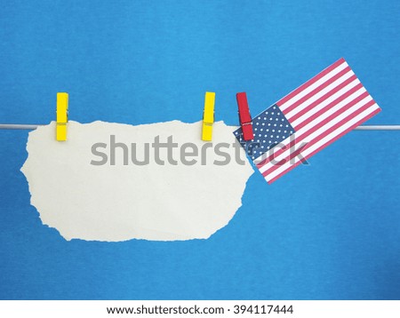 white paper sticker (space for text) Flag of The USA on colorful pegs ( clothespin ). United States of America. Concept - wishes for the holidays, information text.