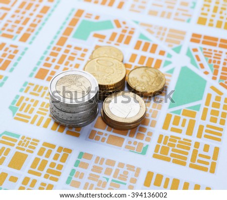 Euro coins on map background