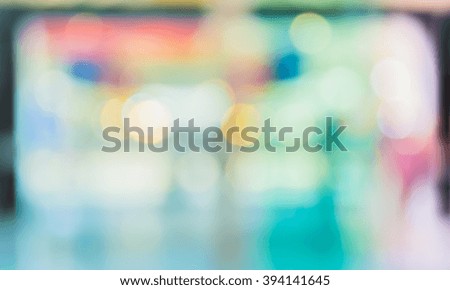 blur image of people in the lobby of a modern business center with a blurred background.