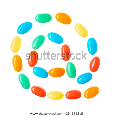 AT symbol, email address icon made of multicolored candies isolated on white background