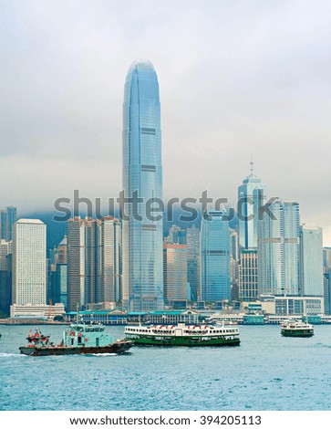 Hong Kong bay with many different ships and rainy clouds
