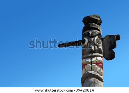 Wooden idol on the background of blue sky.
A Jangseung (village guardian) is a Korean totem pole, to scare away demons.