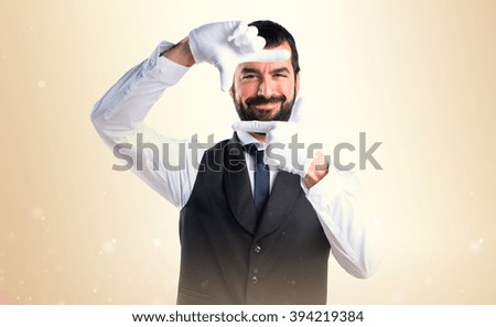 Luxury waiter focusing with his fingers