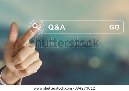 business hand clicking Q&A or Question and Answer button on search toolbar with vintage style effect Royalty-Free Stock Photo #394273012
