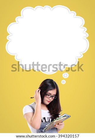 Cute school girl scratching her head in confusion, with empty thought cloud for copy space above her, over yellow background. Education concept in comic style design ready to use