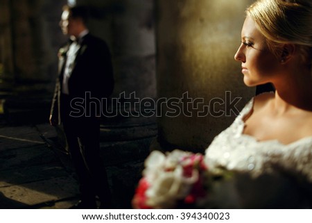 Blonde bride and handsome groom on the wedding walk
