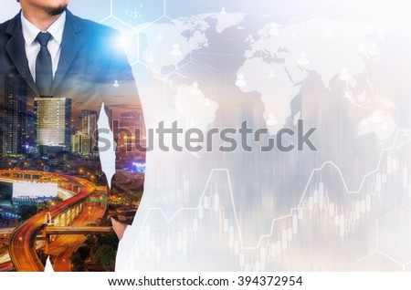 Double exposure of businessman with cityscape and financial graph,network and world map on blurred building background, Elements of this image furnished by NASA.