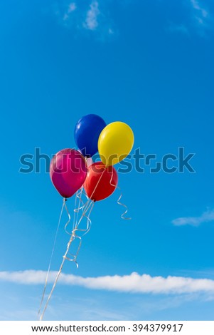 Air-colored balls on a background of blue sky
