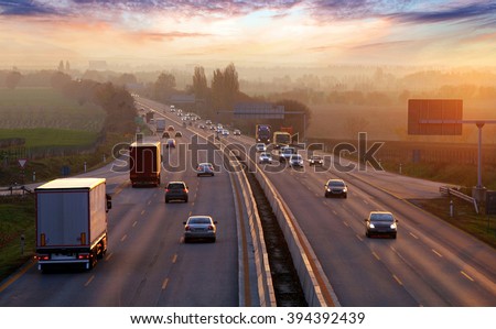 Traffic on highway with cars. Royalty-Free Stock Photo #394392439