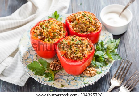 peppers stuffed with quinoa and walnuts. Vegetarian dish Royalty-Free Stock Photo #394395796