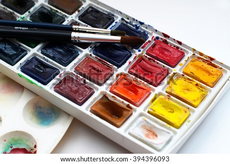 Art watercolor beginner set with brushes, paint set and palette Royalty-Free Stock Photo #394396093