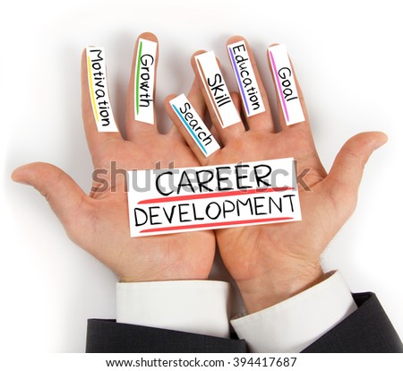 Photo of hands holding paper cards with CAREER DEVELOPMENT concept words