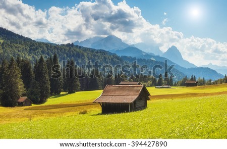 Great view of the green alpine valley glowing in sunlight. Dramatic and picturesque scene. Location famous resort Garmisch-Partenkirchen, Kaltenbrunn, Bavaria, Germany. Artistic picture. Beauty world.