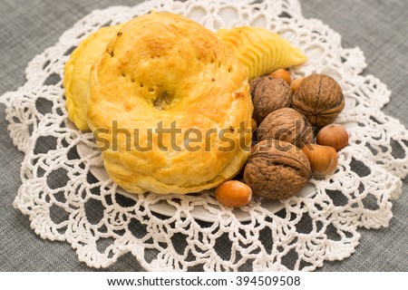 nuts, dried fruits and pastries on the plate