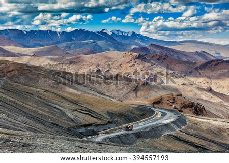 Indian lorry truck on road in Himalayas near Tanglang la Pass  - Himalayan mountain pass on the Leh-Manali highway. Ladakh, India Royalty-Free Stock Photo #394557193