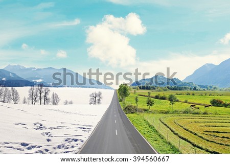 country road through mountainous winter and spring landscape, seasons rotation, climate change Royalty-Free Stock Photo #394560667