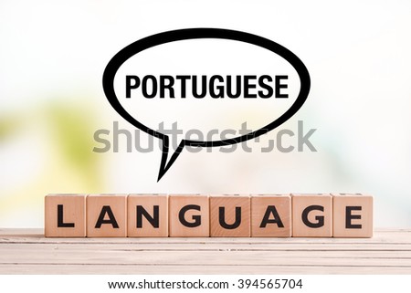 Portuguese language lesson sign made of cubes on a table