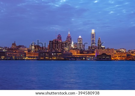 Philadelphia skyline reflected in the Delaware river under a twilight