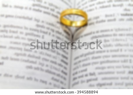 Blurred of the ring on the book have shadow look like heart.
