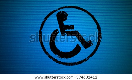 disabled icon sign, old fabric background.