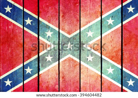 Confederate wooden grunge flag. Flag of the confederacy painted on the old wooden planks. Vintage retro picture from my collection of flags.