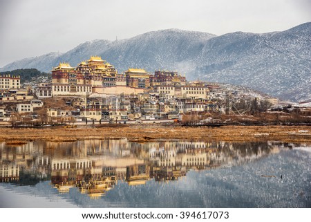 Songzanlin Temple also known as the Ganden Sumtseling Monastery, is a Tibetan Buddhist monastery in Zhongdian city( Shangri-La), Yunnan province China and is closely Potala Palace in Lhasa Royalty-Free Stock Photo #394617073