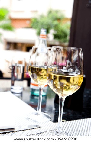 photo of glasses of white wine on a table