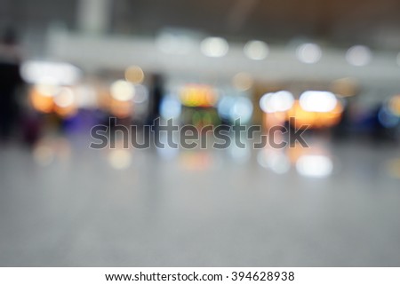 Blurred background : Traveler waiting at airport terminal or train station lobby blur background with bokeh light