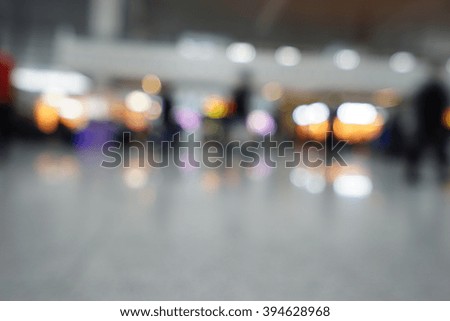 Blurred background : Traveler waiting at airport terminal or train station lobby blur background with bokeh light