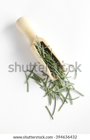 Pine needles on spoon Royalty-Free Stock Photo #394636432