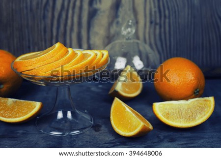 toned orange fruit on wooden background