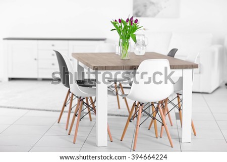 Modern living room with table and chairs