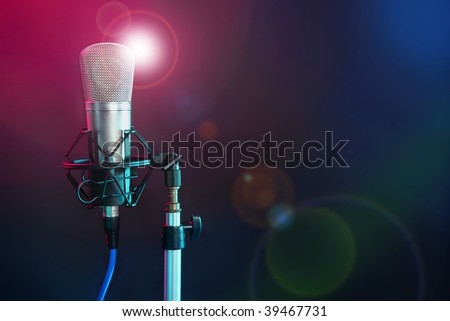 Microphone in the night colorful light in a recording studio [Photo Illustration]
