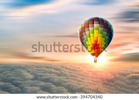 hot air balloon on the top of the clouds