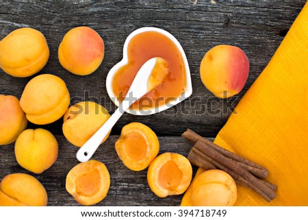  Apricot jam on rustic wooden background
