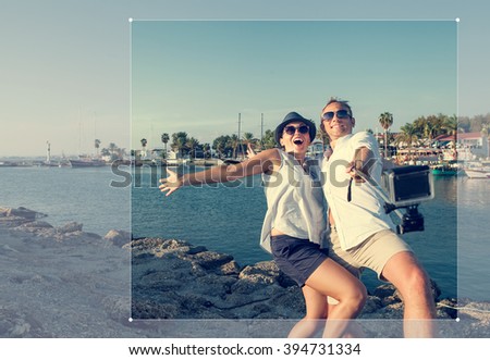 Funny couple take a selfie in the sea bay