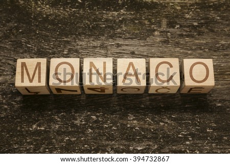 Word MONACO on a wooden background