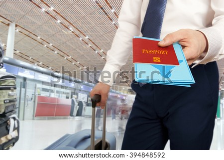 Passport control. Traveling businessman handing passport and ticket