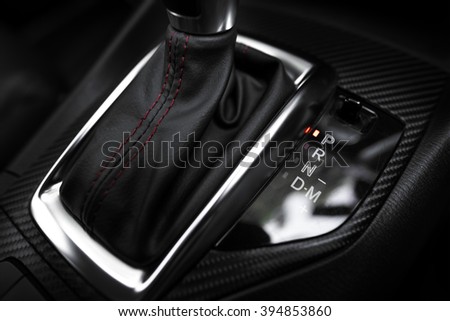 Car interior. The mechanism of switching modes of automatic transmission car.