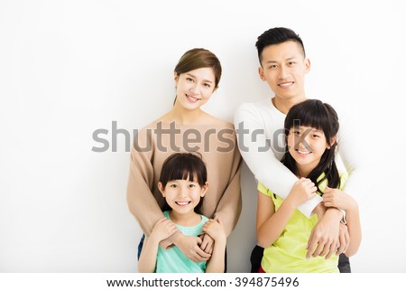 Happy Attractive Young  Family Portrait Royalty-Free Stock Photo #394875496