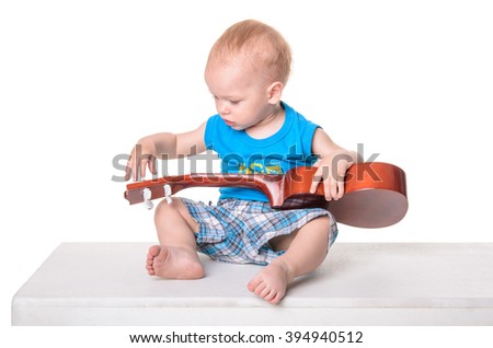 Cute little boy with guitar isolated on white background