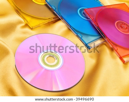 Photo of multicolored discs at the golden fabric
