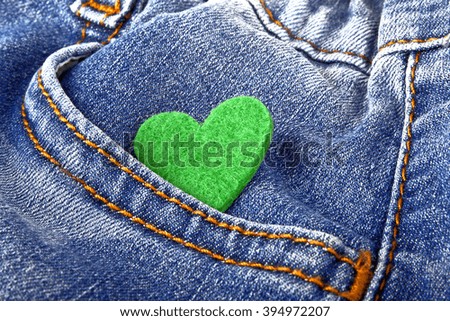 Green heart in jeans pocket